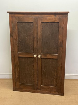 Lot 697 - A stained pine kitchen cupboard with internal...