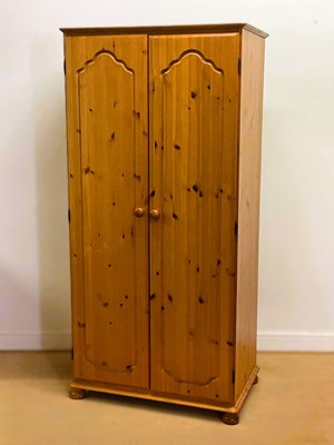 Lot 741 - A modern pine wardrobe with single rail and a...