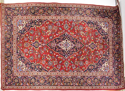 Lot 81 - A Persian wool Kashan carpet, with central...