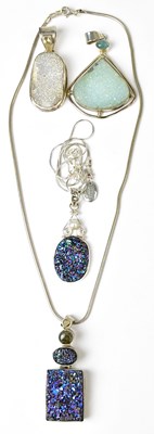 Lot 818 - Four silver pendants set with drusy-style...