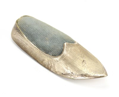 Lot 209 - A Continental white metal novelty pin cushion...