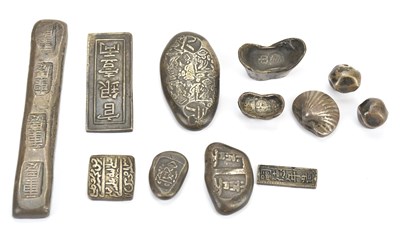 Lot 1635 - A collection of Chinese white metal ingots...