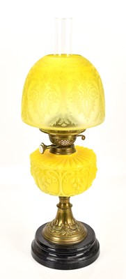 Lot 2229 - A late Victorian oil lamp, the yellow frosted...