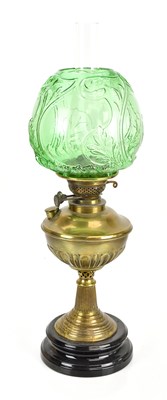 Lot 2244 - A late Victorian brass oil lamp, the green...