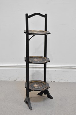 Lot 1277 - A painted lacquered three tier folding cake...