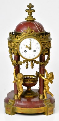 Lot 102 - A French Empire style red marble and cast gilt...