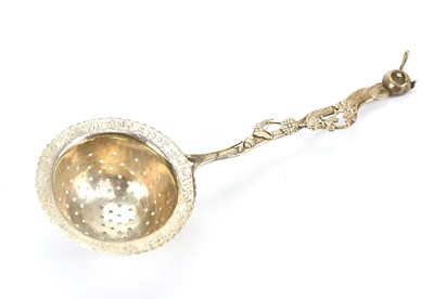 Lot 460 - SUZUKI; a Japanese silver tea strainer with...