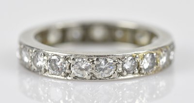 Lot 500 - A white metal diamond set eternity ring,...