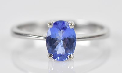Lot 502 - A white metal tanzanite dress ring, the oval...