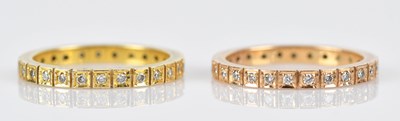 Lot 440 - Two yellow metal diamond set full eternity...