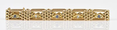 Lot 103 - A 15ct yellow gold gate link diamond and...