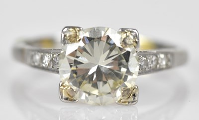 Lot 370 - A platinum diamond solitaire dress ring, the...