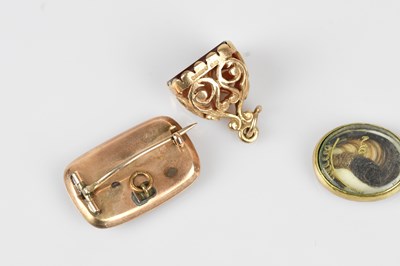 Lot 17 - A 19th century oval mourning brooch in yellow...