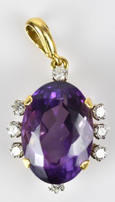 Lot 231 - A good diamond and amethyst pendant, the oval...