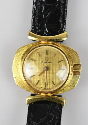 Lot 1161 - OMEGA; a lady's 18ct wristwatch, the textured...