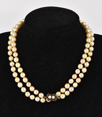 Lot 332 - A single strand cultured pearl necklace, with...