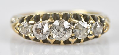 Lot 602 - A diamond five stone dress ring set with round...