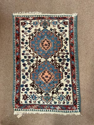 Lot 2170 - A hand knotted woollen Eastern style carpet...