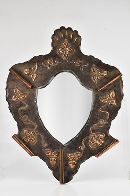 Lot 2077 - A copper Arts and Crafts framed wall mirror...