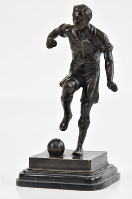 Lot 609 - A bronze figure of a footballer, possibly...