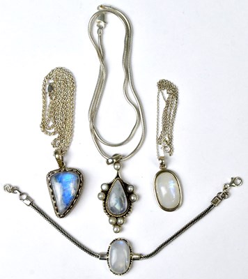 Lot 810 - Three silver and moonstone pendants,...
