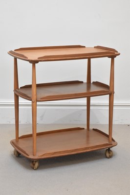 Lot 2120 - ERCOL; a light oak three tier trolley, height...