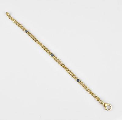 Lot 102 - A yellow metal flat link bracelet set with...