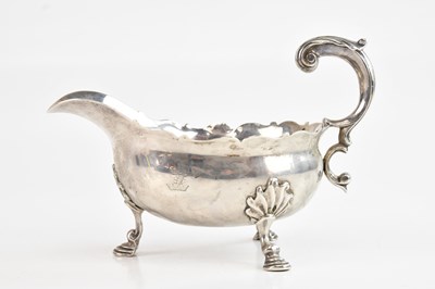 Lot 184 - A George II hallmarked silver sauceboat,...