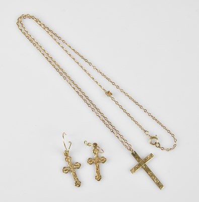 Lot 323 - A 9ct yellow gold cross pendant, suspended on...