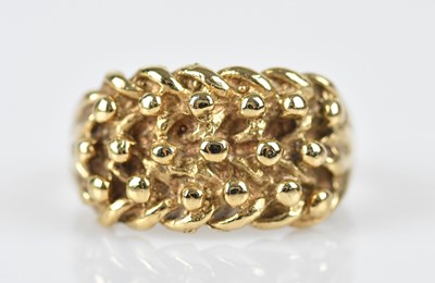 Lot 539 - A 9ct yellow gold keeper ring, size K, approx...