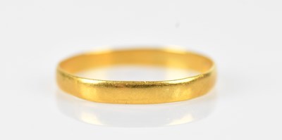 Lot 476 - A 22ct yellow gold wedding band, size N,...