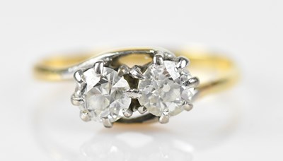 Lot 411 - An 18ct yellow gold and platinum set crossover...