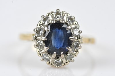 Lot 463 - A diamond and sapphire eleven stone cluster...