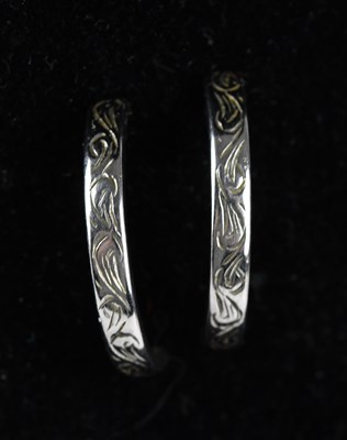 Lot 189 - A pair of white metal half hoop earrings, with...