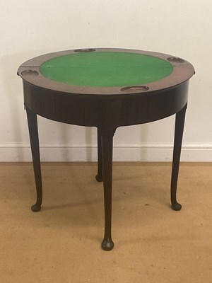 Lot 769 - A mahogany demi-lune fold-over games table...