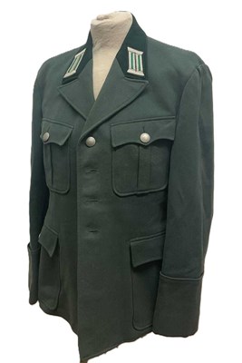 Lot 102 - A post war East German DDR green military...