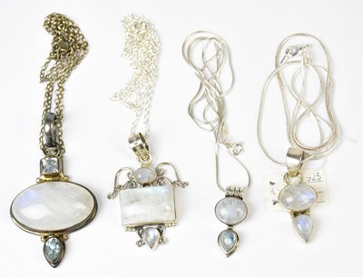 Lot 814 - Four silver and moonstone pendants, comprising...