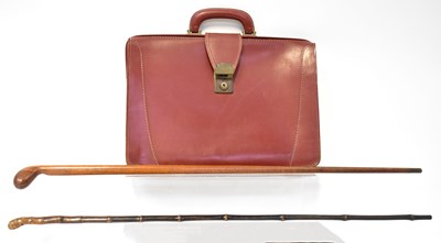 Lot 286 - A vintage leather briefcase with metal mounts,...
