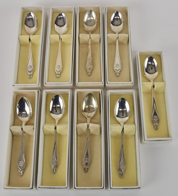 Lot 1139 - A set of nine white metal teaspoons, all...