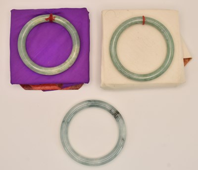Lot 1514 - Three Chinese carved green jade...