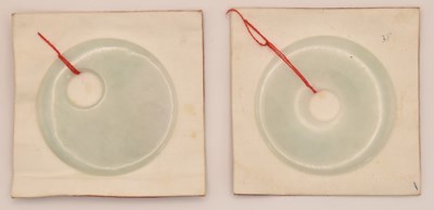 Lot 1536 - Two Chinese carved white nephrite jade bi disc...