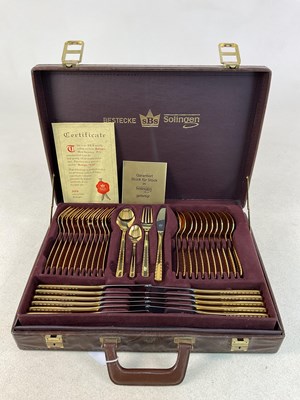 Lot 747 - BESTECKE SOLINGEN; a gold plated cutlery set,...