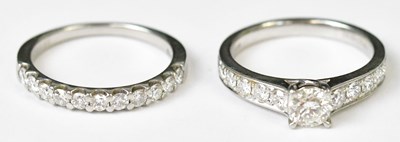 Lot 705A - A platinum diamond solitaire ring, with five...