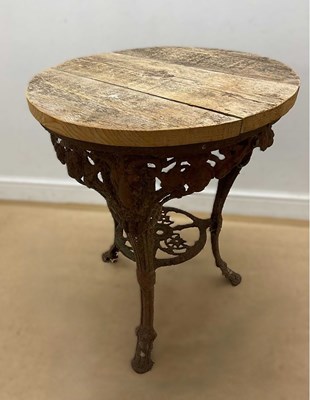 Lot 761 - A cast iron garden table with re-conditioned...