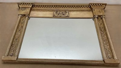 Lot 677 - A large carved pine framed overmantel mirror,...