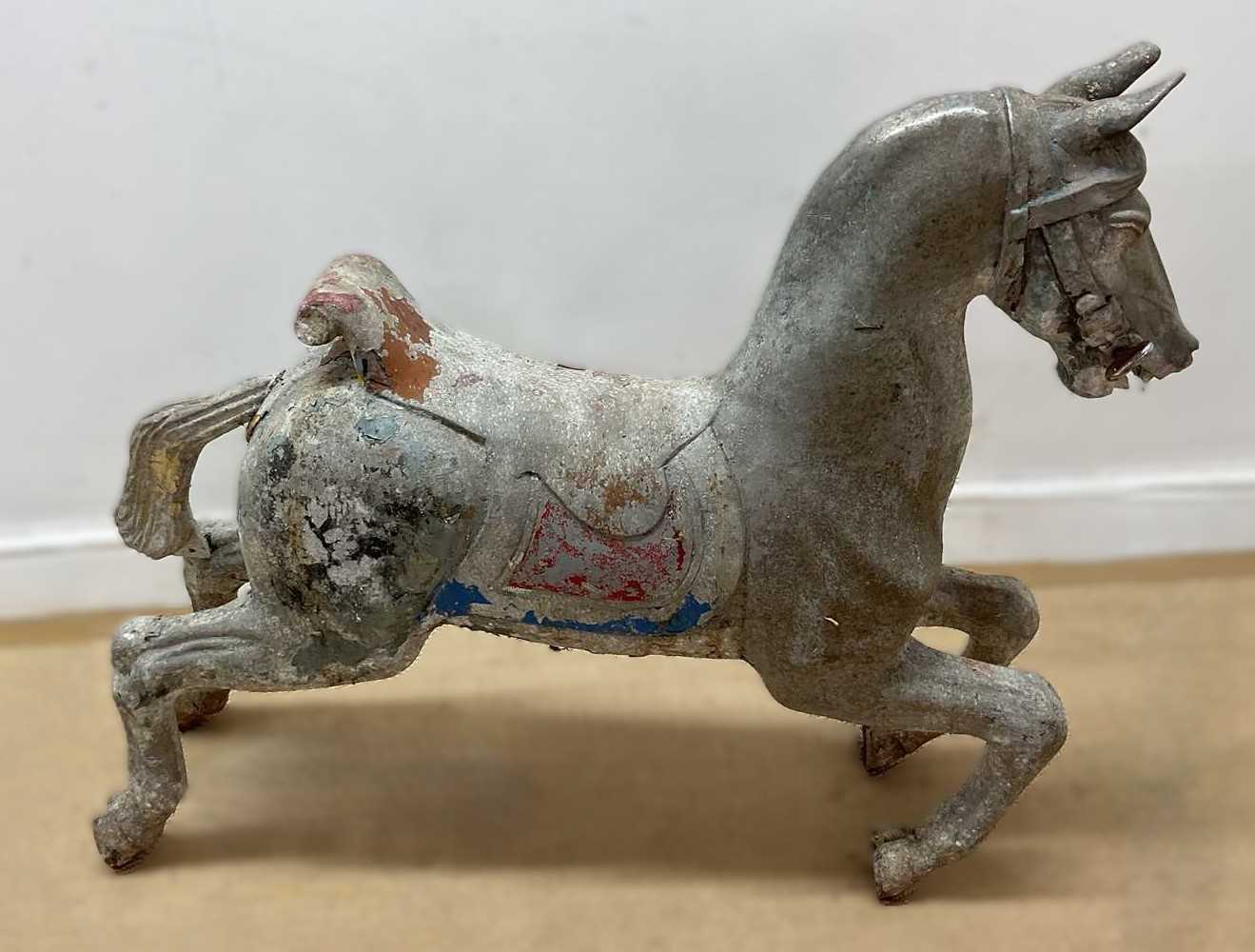 Lot 12 - A large cast metal carousel horse, height 72cm,...