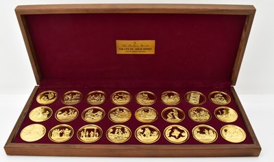 Lot 1565 - DANBURY MINT; a collection of twenty-four 22ct...