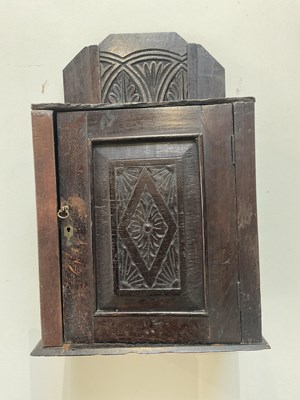 Lot 2014 - A Jacobean style carved oak hanging cupboard...