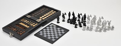 Lot 2147 - A metalic black and silvered set of chess...