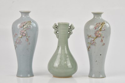 Lot 1153 - A Chinese celadon glazed pear shaped vase,...